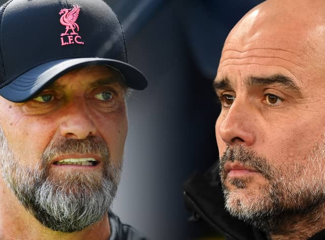 Liverpool manager Jurgen Klopp (L) and Pep Guardiola, Manager of Manchester City (R). (Photo by Michael Regan/Getty Images)