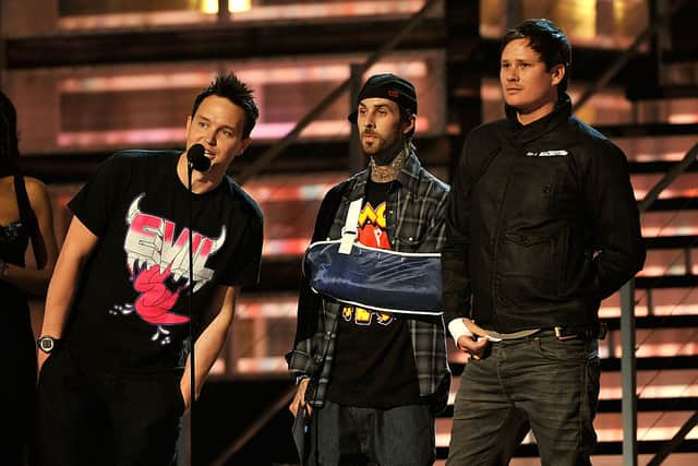 Mark Hoppus, Travis Barker, and Tom DeLonge of Blink 182 speak during the 51st Annual Grammy Awards held at the Staples Center on February 8, 2009 in Los Angeles, California.  (Photo by Kevin Winter/Getty Images)