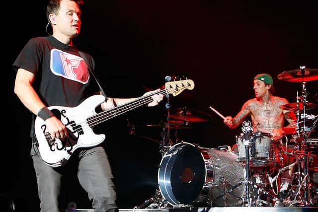 Blink-182 singer/bassist Mark Hoppus (L) and drummer Travis Barker perform during the first show of the band’s reunion tour at The Joint inside the Hard Rock Hotel & Casino July 23, 2009 in Las Vegas, Nevada.  (Photo by Ethan Miller/Getty Images)