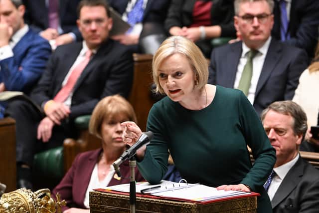 Liz Truss fields questions at her first PMQs after the financial markets fell into chaos. Credit: PA
