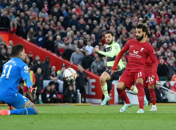 <p>Mohamed Salah scores for Liverpool during fixture against Man City</p>