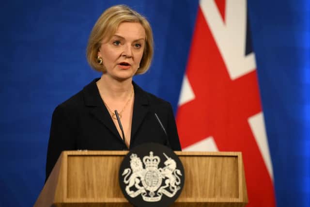 Prime Minister Liz Truss holds a press conference in the Downing Street Briefing Room in central London on October 14, 2022 (Photo by DANIEL LEAL/POOL/AFP via Getty Images)
