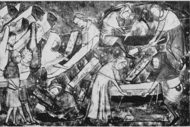 Victims of the Black Death being buried in the Netherland in 1349 (Getty Images)