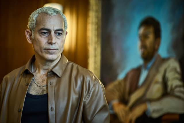 Waleed Zuaiter as Koba in Gangs of London S2, stood in front of an oil painting (Credit: Sky UK/AMC)