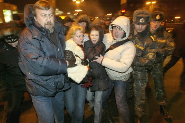 Riot police pictured detaining a demonstrator during a rally in Minsk in 2006. The rally was in honour of opposition figures who have disappeared or been imprisoned under President Alexander Lukashenko’s rule.