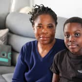 Christine Borton with her son Dayjanta Samuels. See SWNS story SWLNpresents. Cost of living crisis laid bare after mum heartbreakingly reveals her son won't be getting any Christmas presents this year