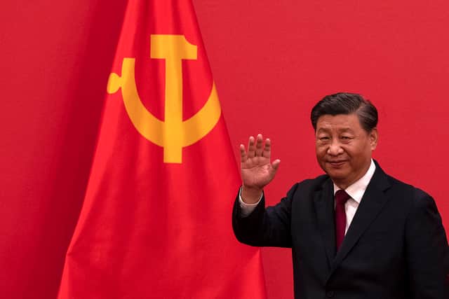 General Secretary and Chinese President, Xi Jinping waves as he leaves after speaking at a press event for the Communist Party of China (Pic: Getty Images)