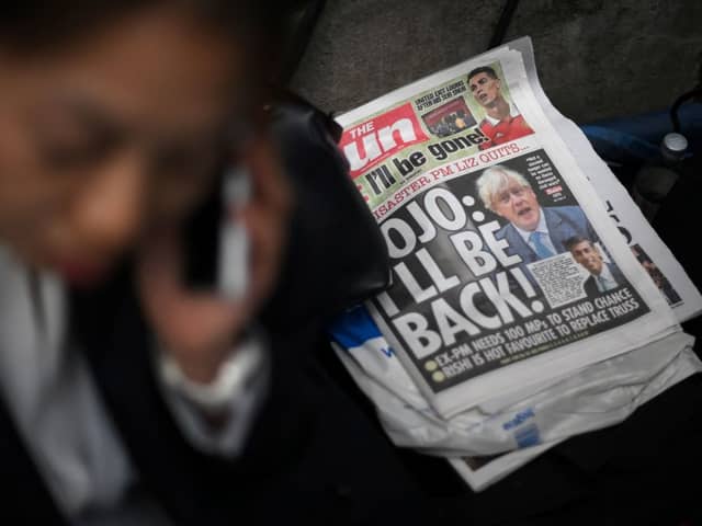 A copy of The Sun newspaper featuring former prime minister Boris Johnson lies on the floor outside 10 Downing Street in central London on 21 October 2022 (Photo: DANIEL LEAL/AFP via Getty Images)