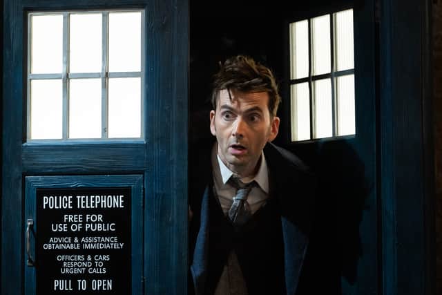 David Tennant as the 14th Doctor, leaning out of the TARDIS (Credit: BBC Studios)