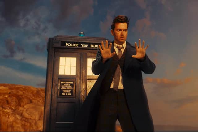 David Tennant as the 14th Doctor, newly regenerated, staring at his hands in shock (Credit: BBC Studios)