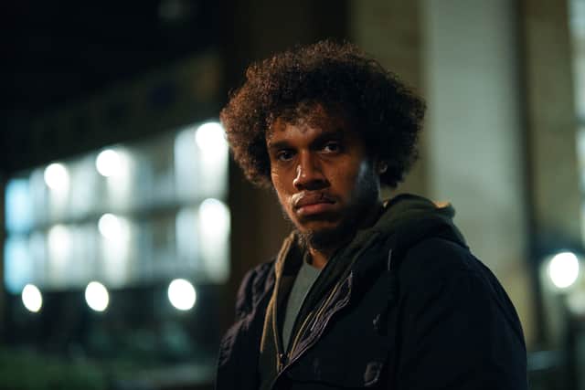 Jordan Wilks as Connor in The Pact S2, pictured at night wearing a black coat (Credit: BBC/Little Door Productions/Simon Ridgway)