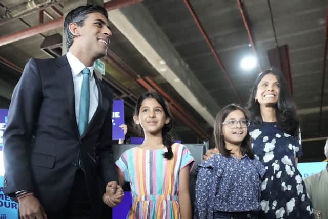 Rishi Sunak with daughters Krisna, Anoushka and wife Akshata Murthy ahead of a speech while campaigning on July 23, 2022 in Grantham, England (Photo by Christopher Furlong/Getty Images,)