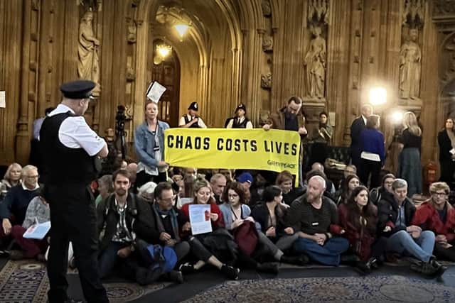 Greenpeace protesters staged a sit-in inside the Houses of Parliament following Rishi Sunak’s selection as Prime Minister. (Credit: Greenpeace/Twitter)