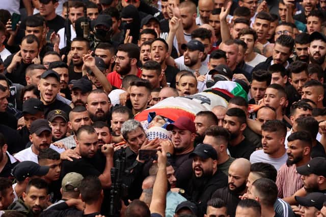 Palestinian mourners carry the body of Tamer Kilani, an alleged Lions’ Den member, during his funeral the city of Nablus in the occupied West Bank on October 23. Credit: JAAFAR ASHTIYEH/AFP via Getty Images