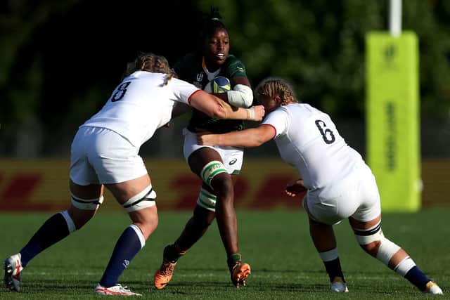 Poppy Cleall and Morwenna Talling tackle Lerato Makua in England v South Africa