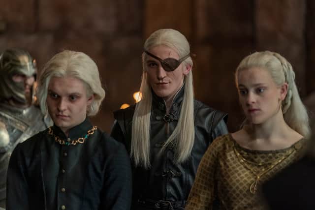 Tom Glynn-Carney as Prince Aegon Targaryen, Ewan Mitchell as Prince Aemond Targaryen, and Phia Saban as Helaena Targaryen (Credit: HBO)