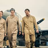 Alfie Allen as Jock Lewes, Connor Swindells as David Stirling, and Jack O’Connell as Paddy Mayne in SAS Rogue Heroes, walking away from an aeroplane (Credit: BBC/Kudos/Robert Viglasky)