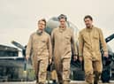 Alfie Allen as Jock Lewes, Connor Swindells as David Stirling, and Jack O’Connell as Paddy Mayne in SAS Rogue Heroes, walking away from an aeroplane (Credit: BBC/Kudos/Robert Viglasky)