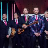 Alex Horne (band leader, centre, wearing a floral jacket) and the Horne Section, comprised of Joe Auckland (trumpet and banjo), Mark Brown (saxophone and guitar), Will Collier (bass), Ben Reynolds (drums and percussion), Ed Sheldrake (keyboards). (Credit: Channel 4)