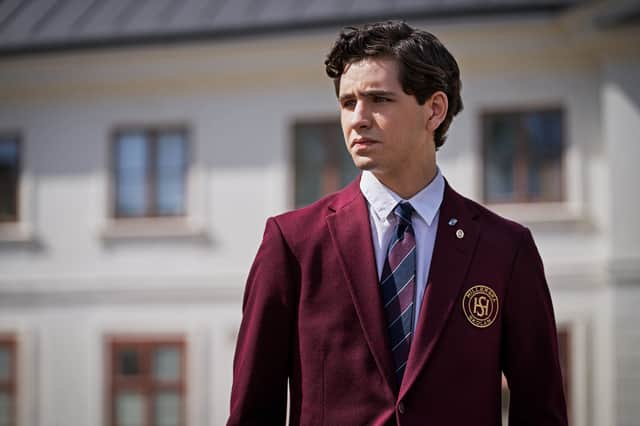 Malte GaÌrdinger as August in Young Royals S2, wearing a red school blazer (Credit: Robert Eldrim/Netflix)