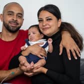 Reuben Gordon and Bethany Homar with son Isaiah Gordon., who is finally home after spending months in hospital after his heart stopped beating for 17 minutes when he was born prematurely.