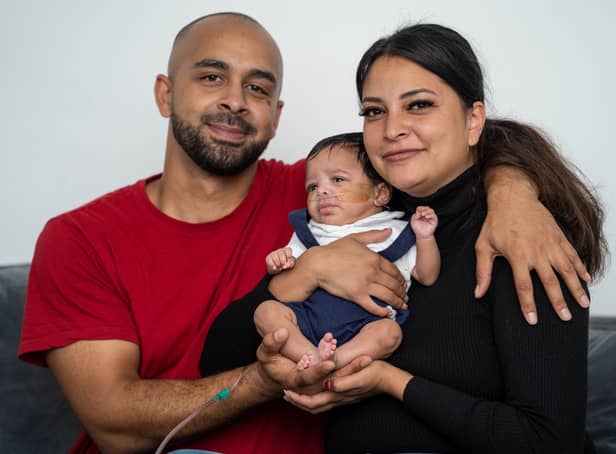 <p>Reuben Gordon and Bethany Homar with son Isaiah Gordon., who is finally home after spending months in hospital after his heart stopped beating for 17 minutes when he was born prematurely.</p>