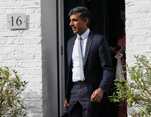 Rishi Sunak leaves his house in London - one of four properties he owns (PA)