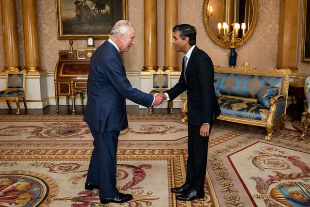 King Charles III welcomes Rishi Sunak during an audience at Buckingham Palace (PA)
