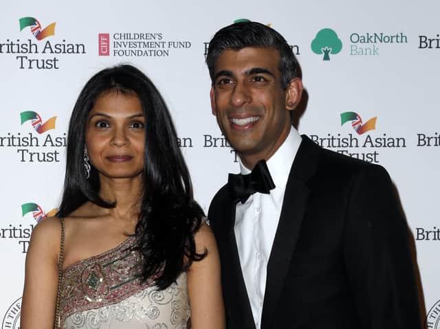 <p>Rishi Sunak with his wife Akshata Murthy, whose father owns a multi-billion pound IT firm (AFP via Getty Images)</p>