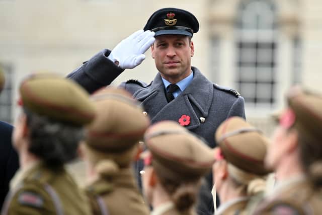 Britain’s Prince William,  salutes military personnel (Getty Images)