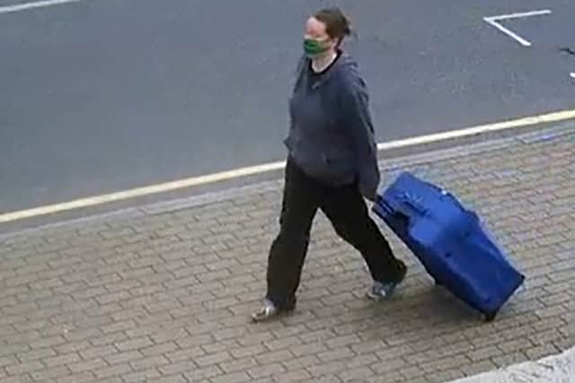 A screen grab taken from CCTV issued by Metropolitan Police of Jemma Mitchell on Chaplin Road, north west London dragging a blue suitcase on 11 June 2021.