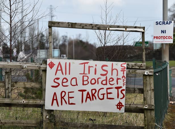 <p>A banner threatens port staff near Larne harbour (Pic: Getty Images)</p>