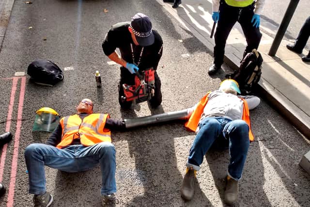 Just Stop Oil protesters glue and bolt themselves to roads. Credit: Just Stop Oil