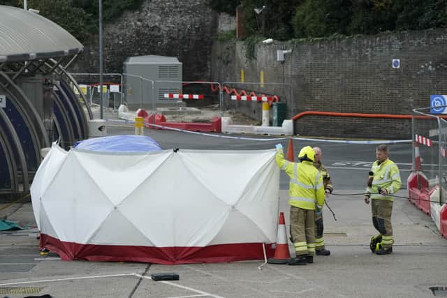 The emergency services erect a tent around the car allegedly involved in an incident near the migrant processing centre in Dover, Kent. Credit: PA