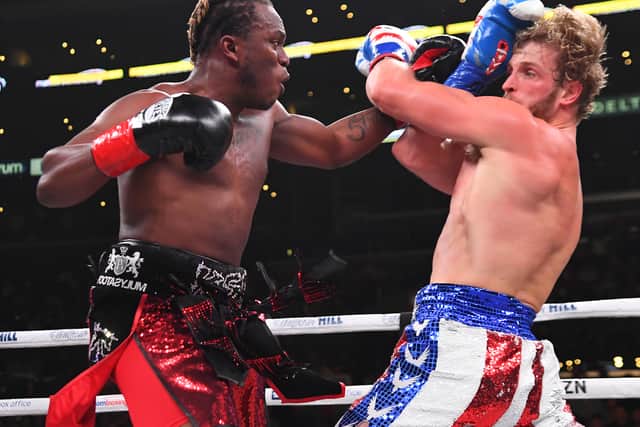 Logan Paul (red/white/blue shorts) and KSI (black/red shorts) exchange punches during their pro debut fight at Staples Center on November 9, 2019 in Los Angeles, California. KSI won by decision