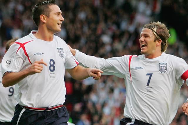 Goal scorer Frank Lampard of England celebrates with David Beckham during the World Cup 2006 Group 6 qualifying match between England and Austria at Old Trafford on October 8, 2005 in Manchester, England.  (Photo by Ross Kinnaird/Getty Images)