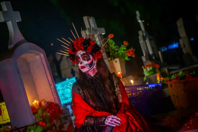 A woman dressed as “La Llorona” in a pantheon as part of the ‘Day of the Dead’ celebration in Tijuana, Mexico (Getty Images)