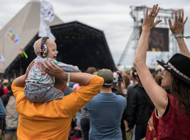 <p>A family with a baby wearing ear defenders on his fathers shoulders watch Hacienda Classical on the Pyramid stage at Glastonbury Festival 2017 (Photo: Chris J Ratcliffe/Getty Images)</p>