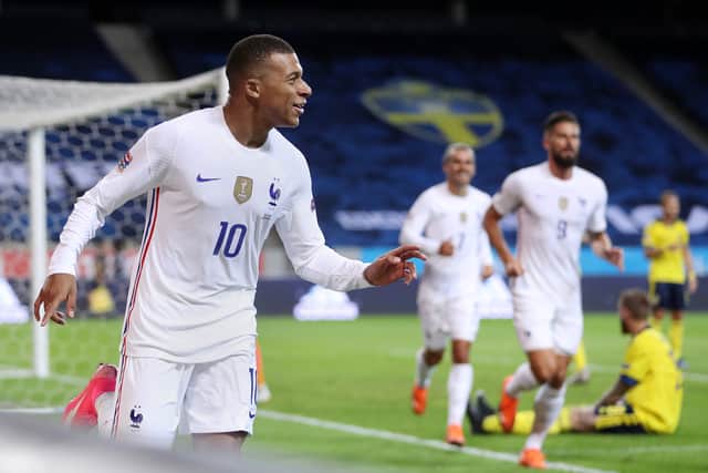 Kylian Mbappe celebrates scoring in Nations League