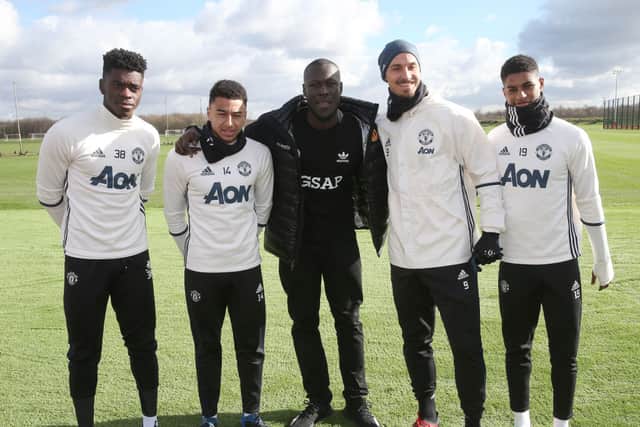Stormzy meets players from his favourite team Manchester United (Pic: John Peters/Manchester United via Getty Images)