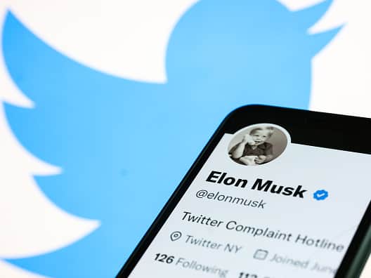 Elon Musk’s Twitter account displayed on a phone screen (NurPhoto via Getty Images)