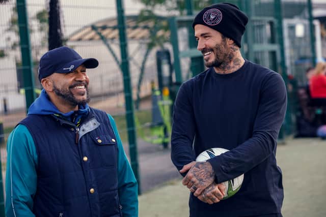 David Beckham in Save Our Squad, with a member of the team (Credit: James Turner/Disney+)
