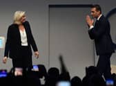 Newly elected French far-right party Rassemblement National (RN)’s president Jordan Bardella, next to French far-right party Rassemblement National (RN) parliamentary group leader Marine Le Pen (L). (Photo by ALAIN JOCARD/AFP via Getty Images)