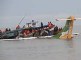 Rescuers search for survivors after a Precision Air flight that was carrying 43 people plunged into Lake Victoria as it attempted to land in the lakeside town of Bukoba, Tanzania on November 6, 2022. - Three people died when a plane carrying dozens of passengers plunged into Lake Victoria in Tanzania on November 6, 2022, as it approached the northwestern city of Bukoba, the fire and rescue service said. Rescuers have pulled 26 survivors to safety after the Precision Air plane crashed due to bad weather, with 43 people, including 39 passengers, aboard flight PW 494 from the financial capital Dar es Salaam to the lakeside city, according to regional authorities. (Photo by SITIDE PROTASE / AFP) (Photo by SITIDE PROTASE/AFP via Getty Images)