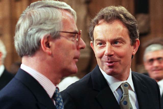 Leader of the Opposition John Major with Prime Minister Tony Blair in May 1997, walking to the state opening of Parliament (Credit: JOHNNY EGGITT/AFP via Getty Images)