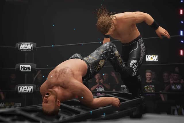 ‘Hangman’ Adam Page powerbombs Jon Moxley onto a ladder in AEW Fight Forever (Image: THQ Nordic)
