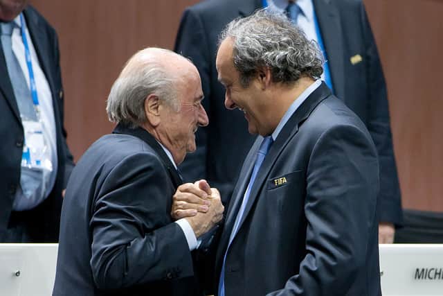Blatter (L) shakes hands with UEFA president Michel Platini in 2015 (Photo: Philipp Schmidli/Getty Images)