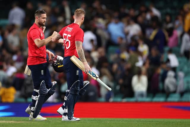 Woakes and Stokes leave the field after ensuring England reached semi-final 