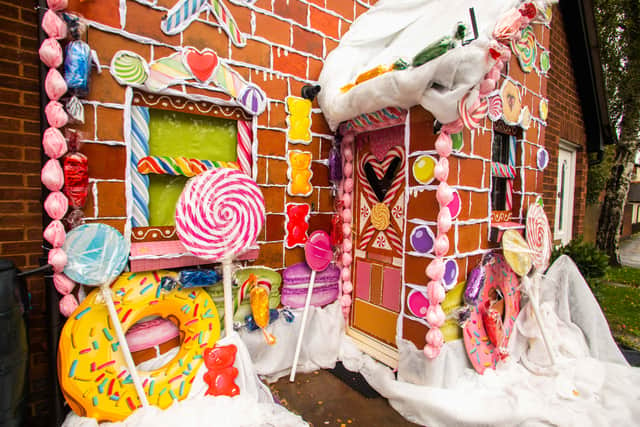 Carmen Croxall, 34, has decorated the front of her rented home in Exeter, Devon, to look like a gingerbread house - including biscuits, icing, Quality Street chocolates, and lollipops.