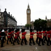 Grenadier Guards march past the Elizabeth Tower, more commonly known as Big Ben in London. (Photo by SARAH MEYSSONNIER/POOL/AFP via Getty Images)